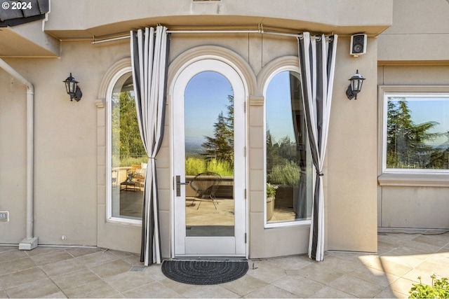 doorway to property featuring a patio