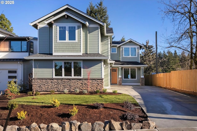 craftsman-style home with a front yard