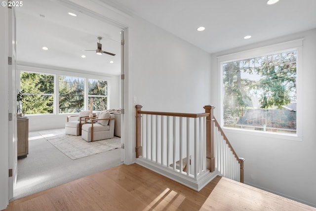 stairway featuring recessed lighting and wood finished floors