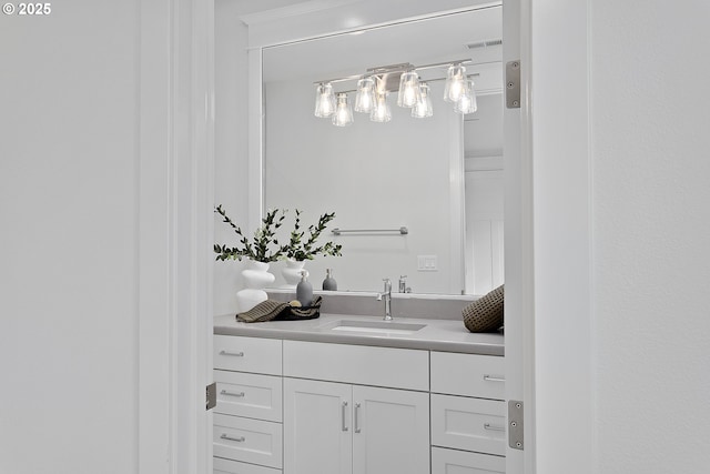 bathroom featuring visible vents and vanity