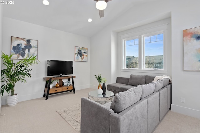 living room featuring light carpet, baseboards, and vaulted ceiling