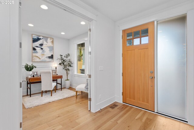 entrance foyer with hardwood / wood-style floors