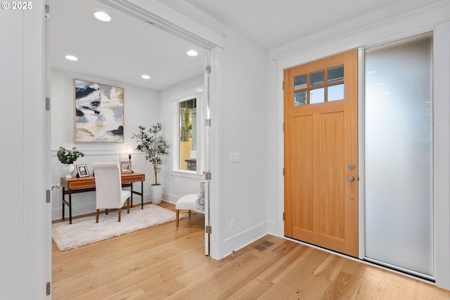 entryway featuring recessed lighting, visible vents, baseboards, and light wood-style flooring