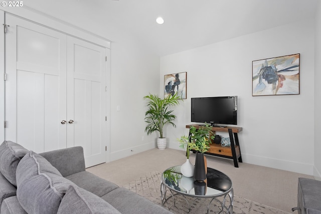 carpeted living room featuring recessed lighting and baseboards