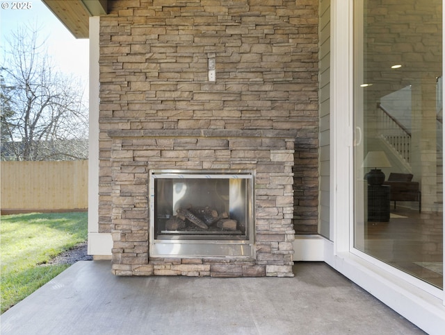 room details featuring an outdoor stone fireplace