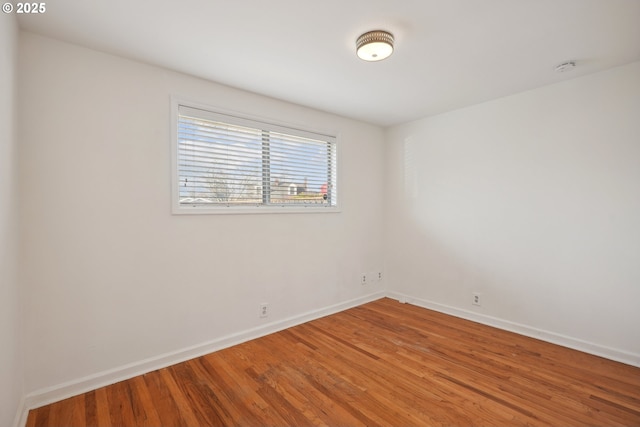 empty room with wood-type flooring