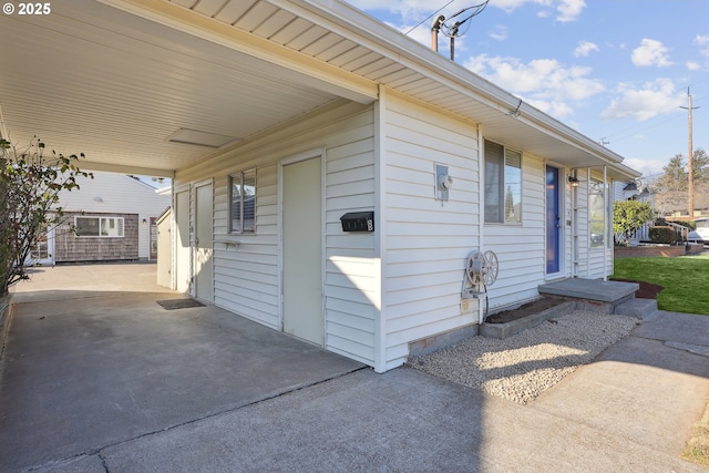 view of property exterior featuring a carport