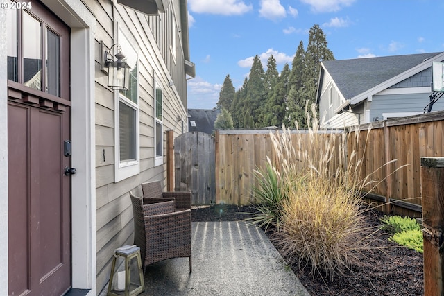 view of patio / terrace featuring fence