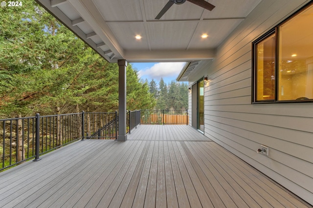 wooden deck featuring a ceiling fan