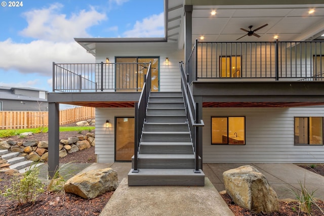 rear view of house featuring a patio area, stairway, a ceiling fan, and fence