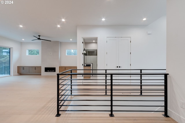 interior space with recessed lighting, baseboards, wood finished floors, and a ceiling fan