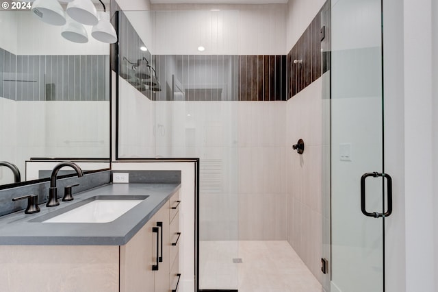 bathroom featuring vanity and a shower stall