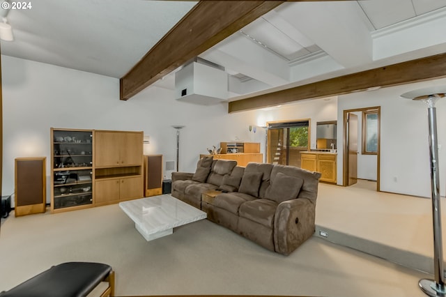 living room with carpet flooring and beamed ceiling