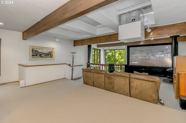 cinema room with carpet and beamed ceiling