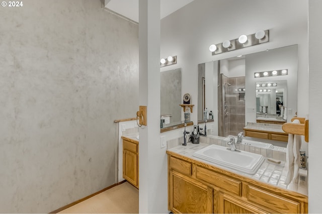 bathroom with vanity and an enclosed shower