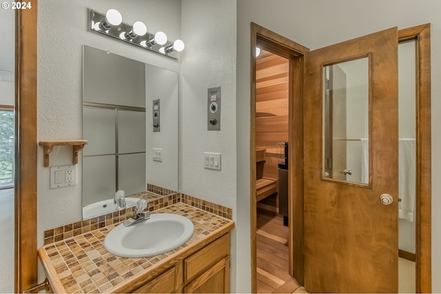 bathroom featuring hardwood / wood-style floors and vanity