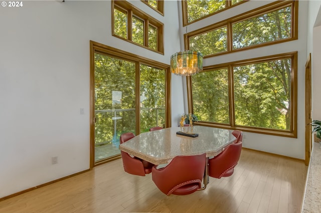 sunroom / solarium with a notable chandelier and plenty of natural light