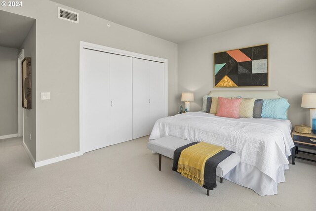 bedroom featuring carpet and a closet