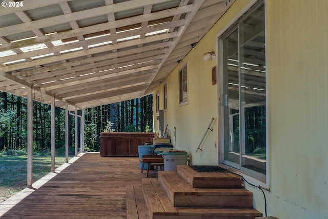 deck featuring a hot tub