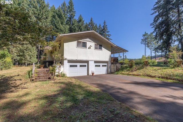 view of side of property with a garage