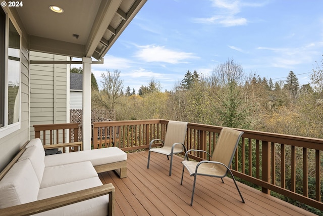 wooden deck with outdoor lounge area