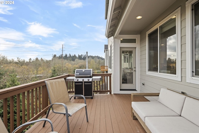 wooden terrace with area for grilling