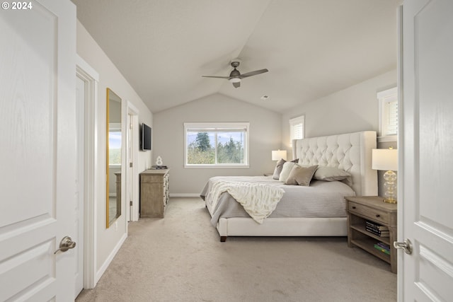 carpeted bedroom with ceiling fan and lofted ceiling