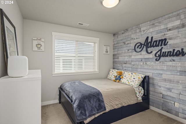 bedroom featuring light colored carpet