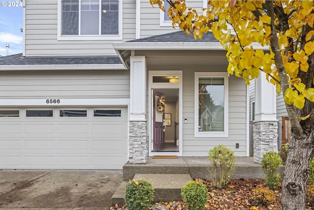 view of exterior entry with a garage