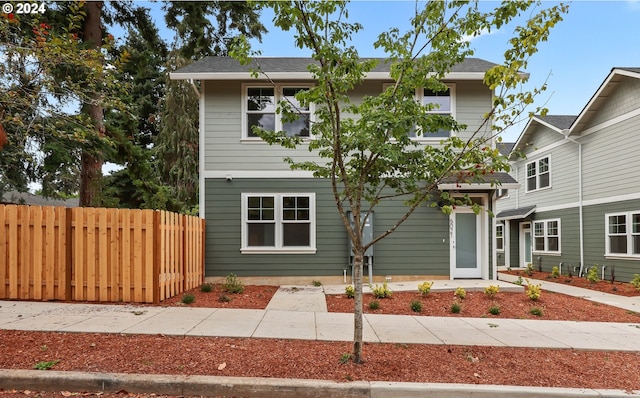 view of front of home with fence