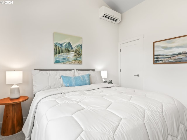 bedroom with carpet floors and a wall mounted AC