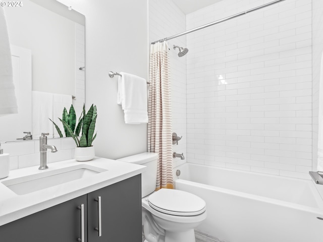 full bathroom featuring shower / tub combo, toilet, and vanity