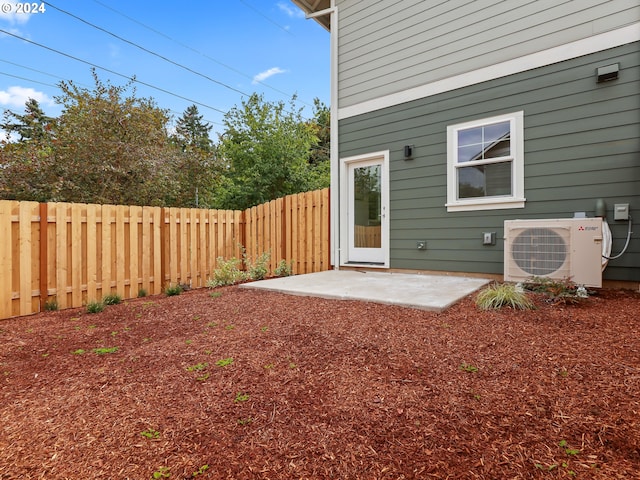 view of yard featuring ac unit, a fenced backyard, and a patio