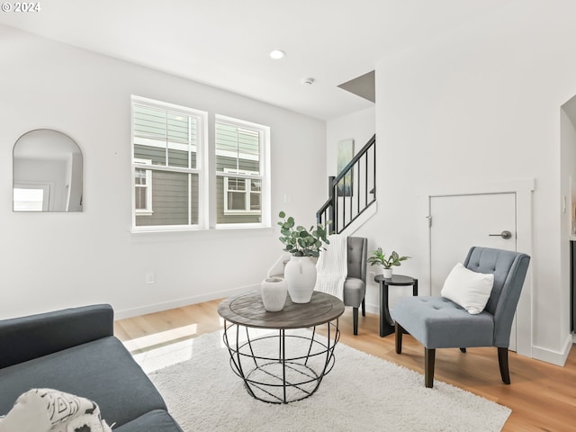 living room with light hardwood / wood-style flooring