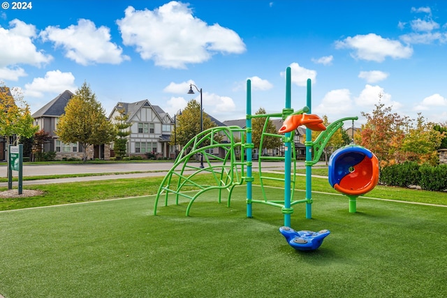 view of play area featuring a lawn