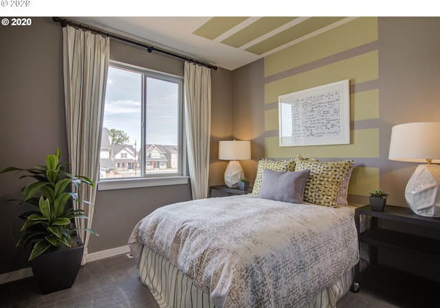 bedroom featuring dark carpet