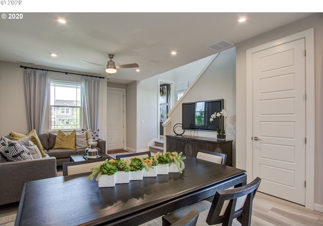 dining room featuring light wood-type flooring and ceiling fan