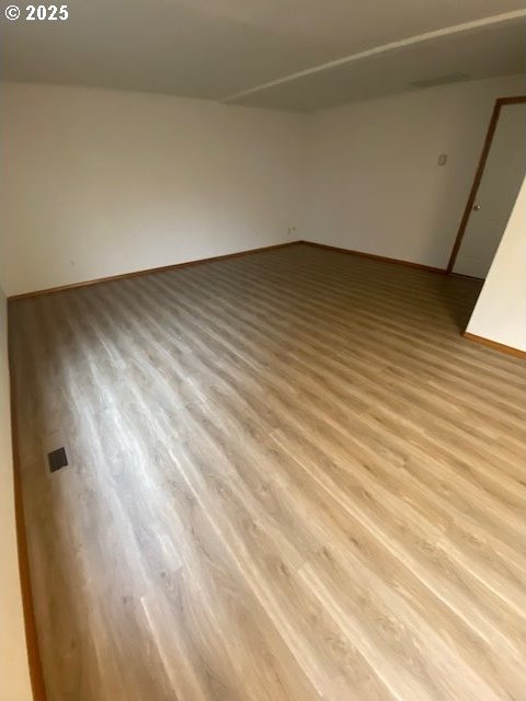 spare room featuring light hardwood / wood-style flooring