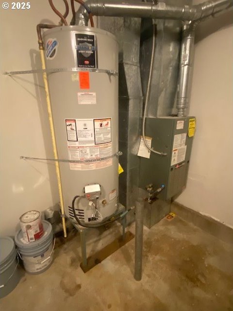 utility room featuring water heater