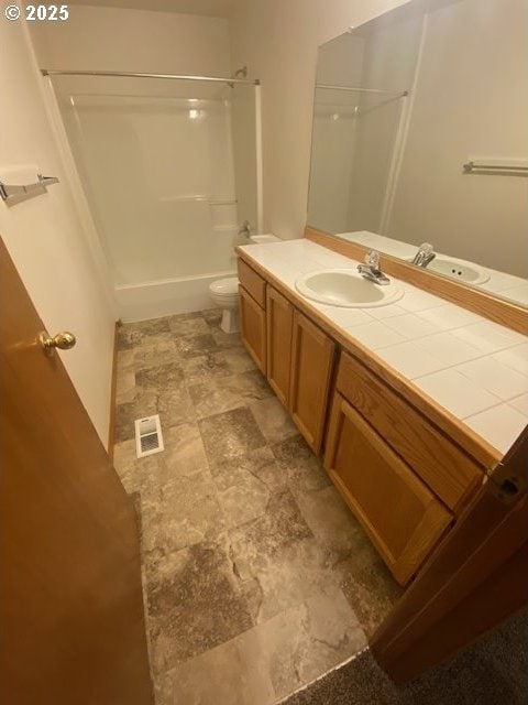 full bathroom featuring vanity, toilet, and bathing tub / shower combination