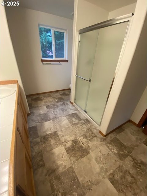 bathroom with vanity and an enclosed shower