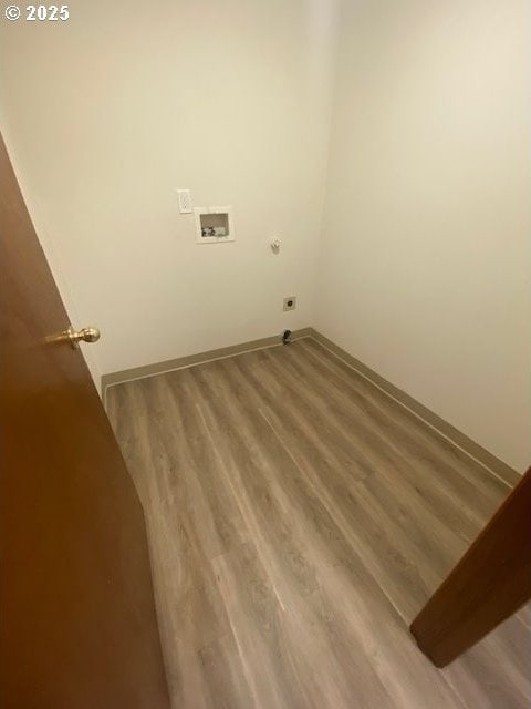 washroom featuring hookup for an electric dryer, washer hookup, and hardwood / wood-style flooring