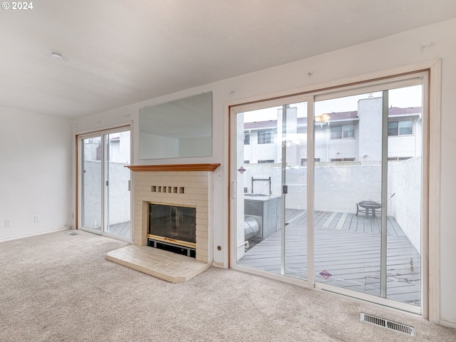 3242 NE 29th St, Gresham, OR 97030 - unfurnished living room with carpet floors and a fireplace