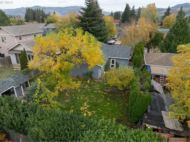 birds eye view of property with a mountain view