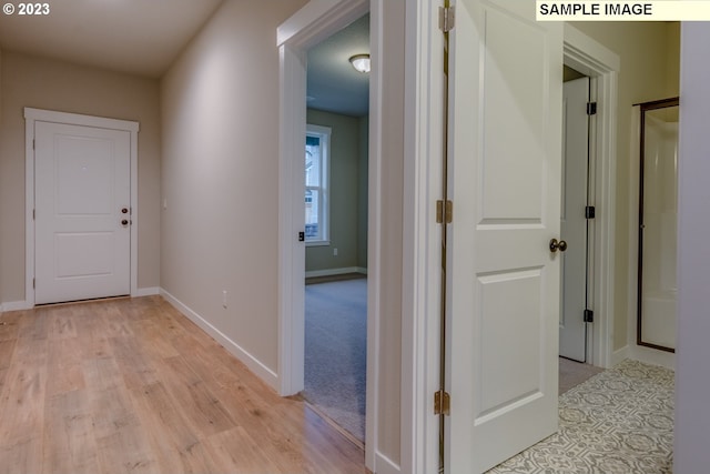 hall featuring light wood-type flooring