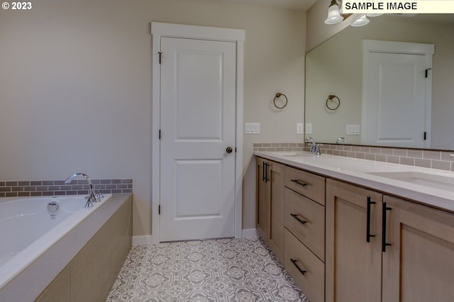 bathroom with vanity, tiled bath, and tile patterned floors