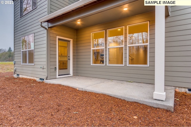 doorway to property featuring a patio area