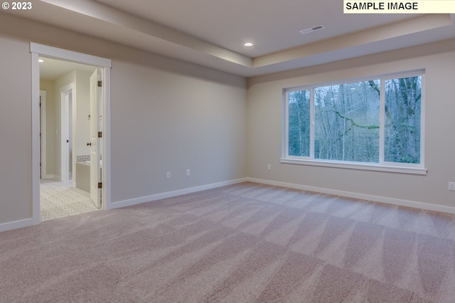 empty room with light colored carpet