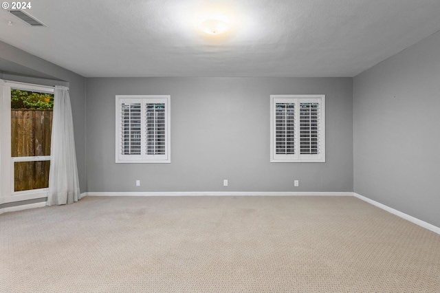 empty room featuring carpet flooring