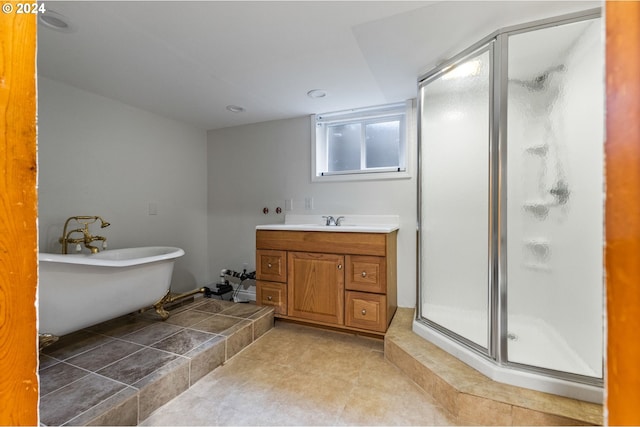 bathroom featuring vanity and shower with separate bathtub